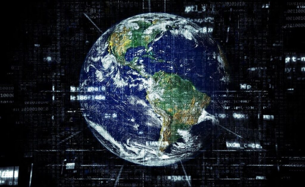 A foto mostra o planeta Terra com linhas e números que lembram a rede da internet, dando uma sensação de conectividade global.